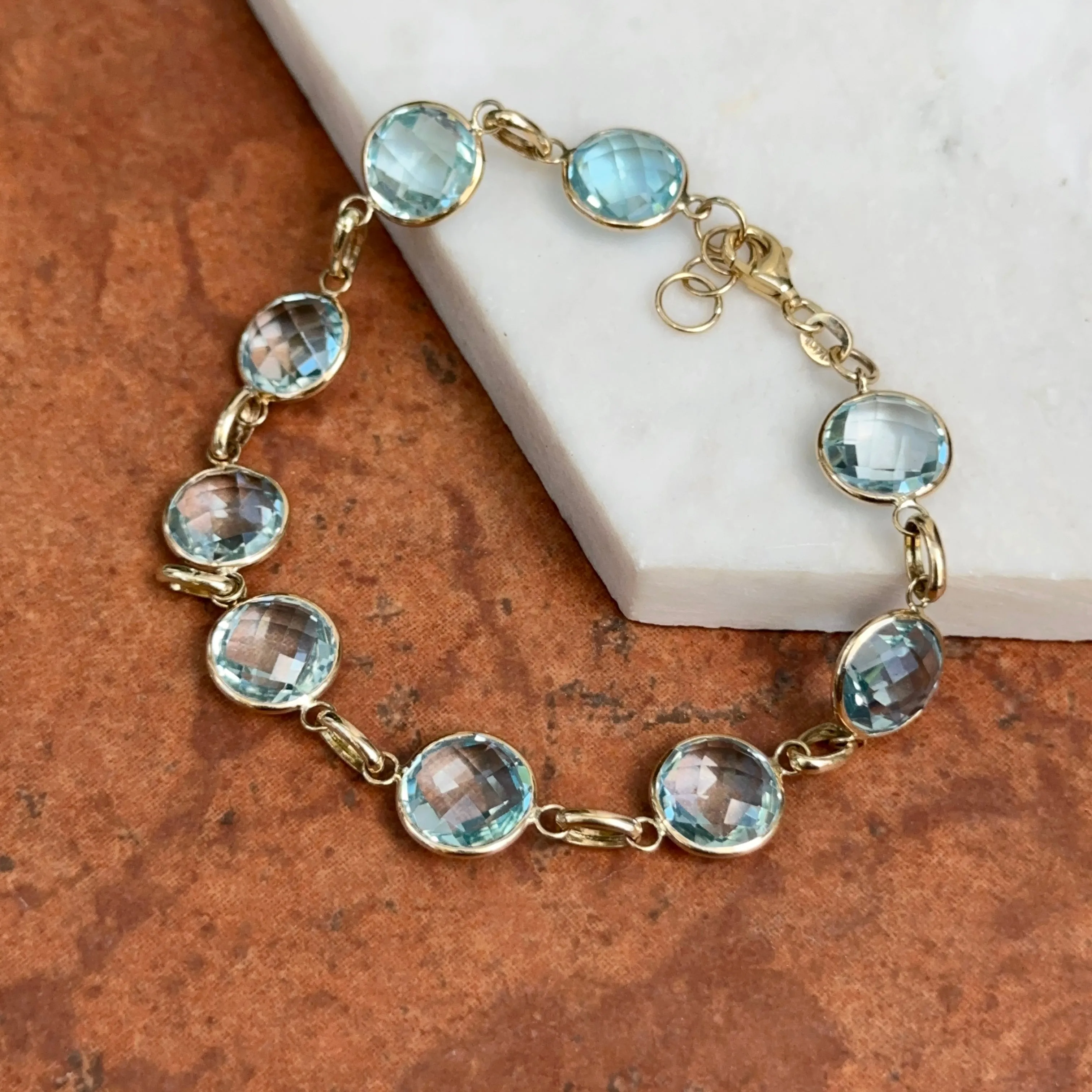 14KT Yellow Gold Checkerboard Faceted Blue Topaz Bezel Set Bracelet