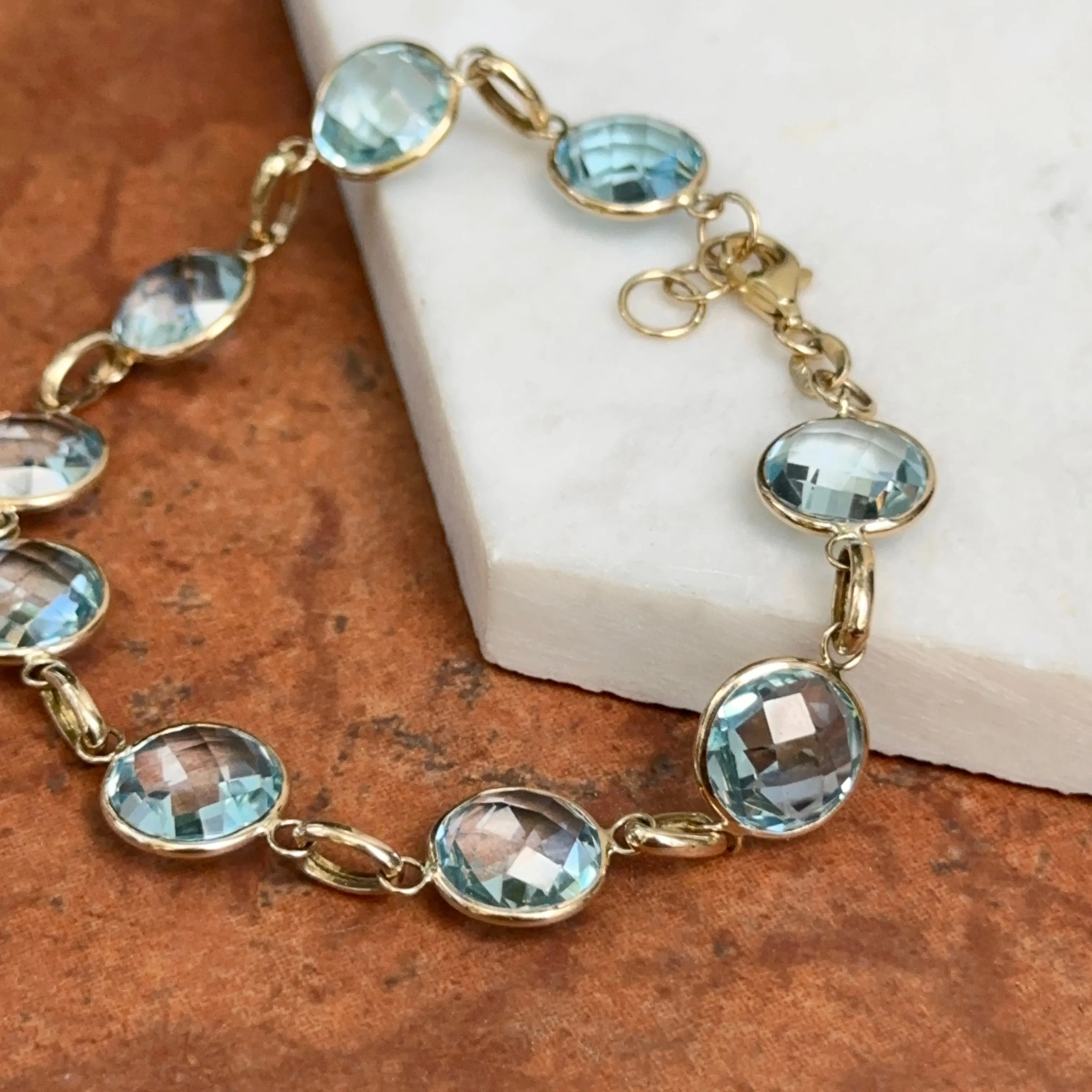 14KT Yellow Gold Checkerboard Faceted Blue Topaz Bezel Set Bracelet