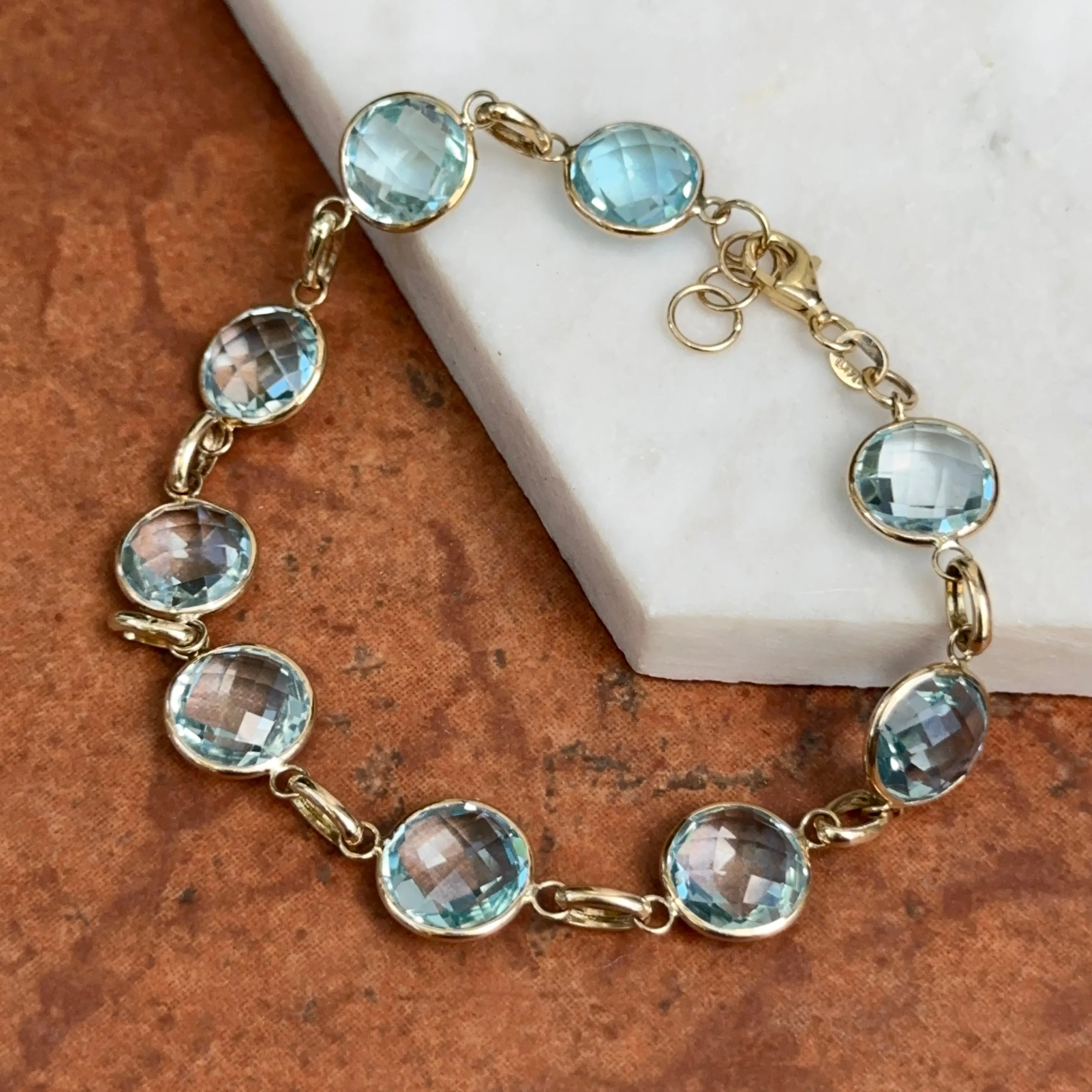 14KT Yellow Gold Checkerboard Faceted Blue Topaz Bezel Set Bracelet