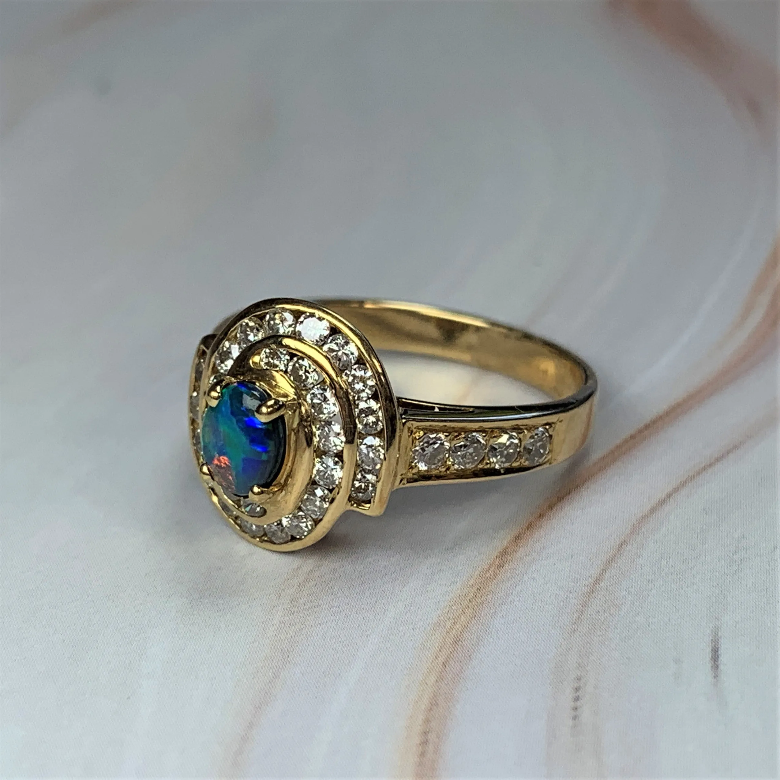 18kt Yellow Gold cluster Black Opal 0.3 Diamonds 0.44 ring