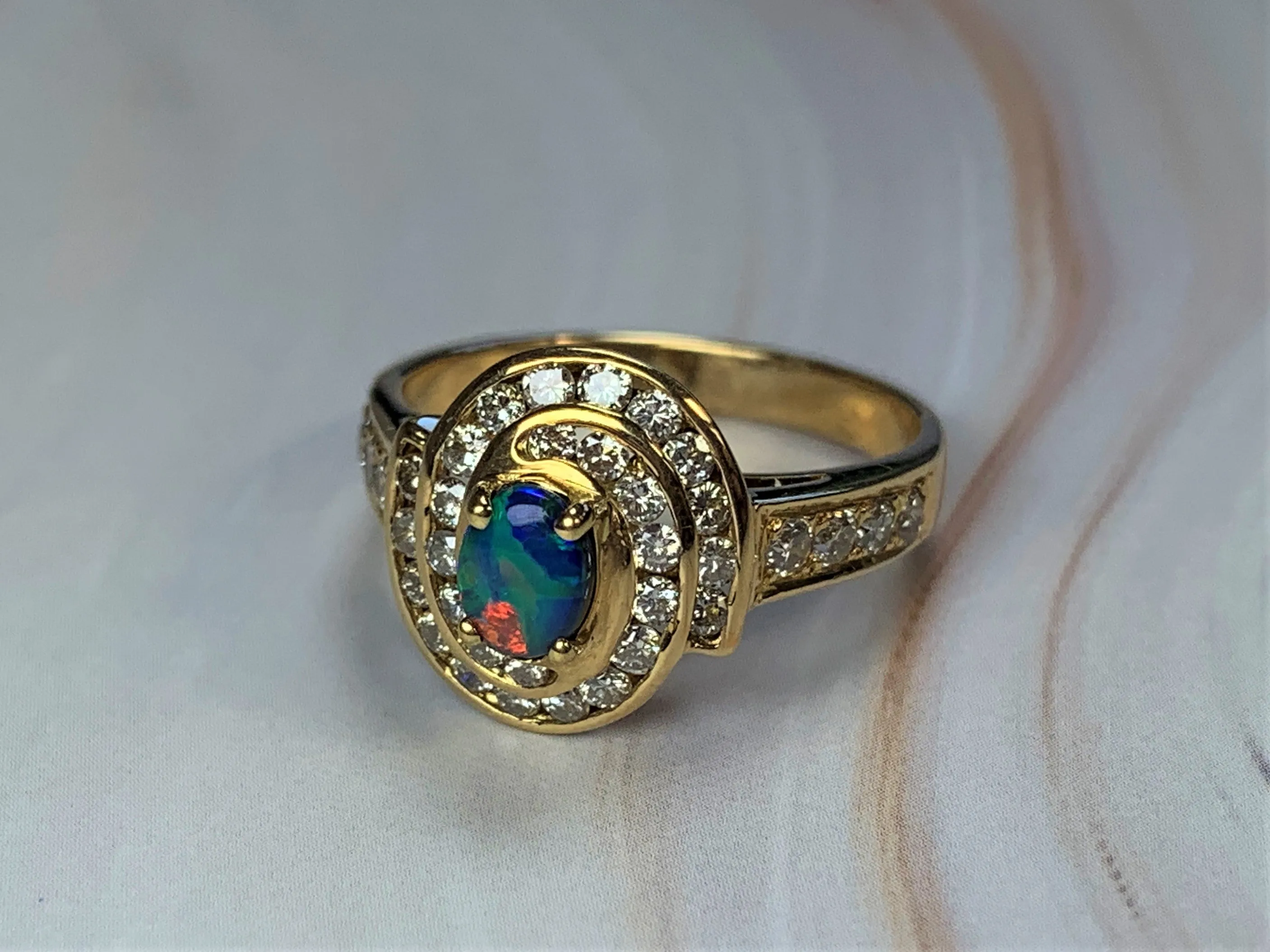 18kt Yellow Gold cluster Black Opal 0.3 Diamonds 0.44 ring