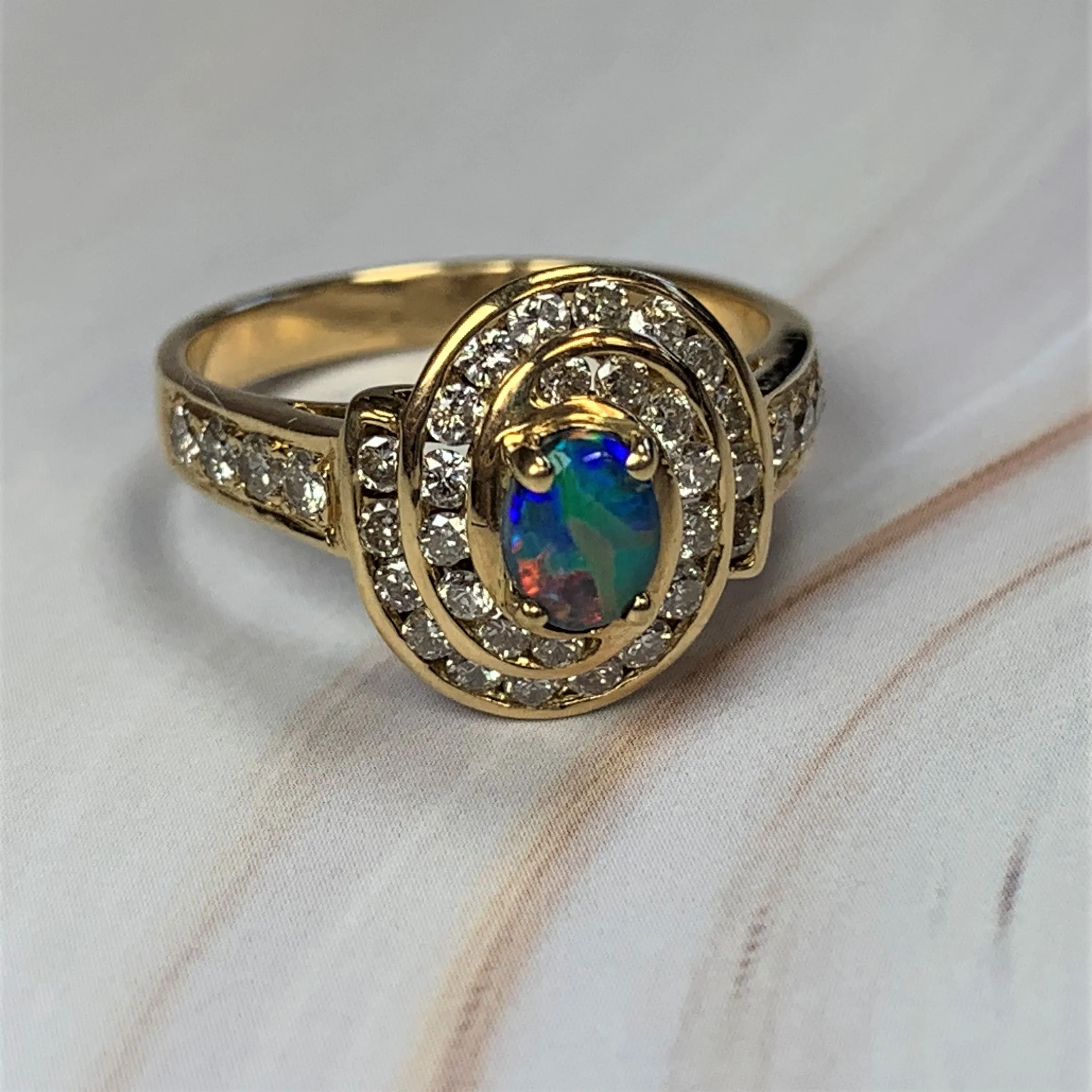 18kt Yellow Gold cluster Black Opal 0.3 Diamonds 0.44 ring
