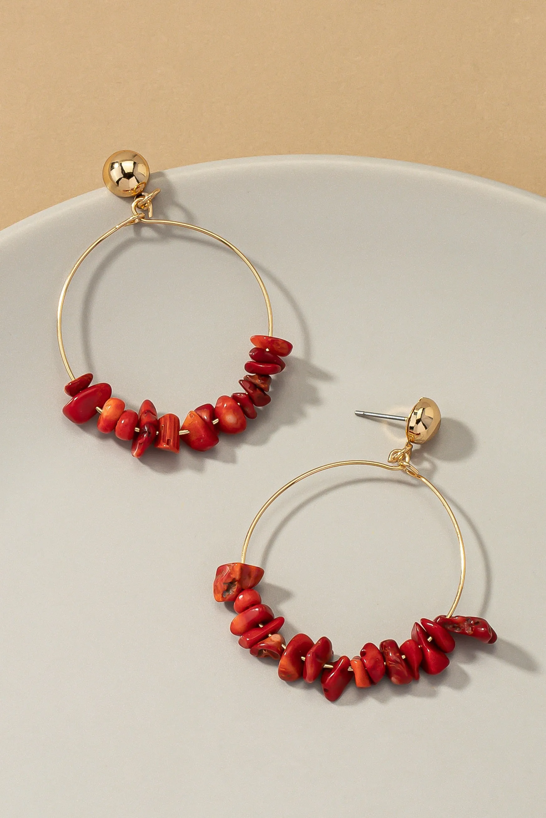 Dangling hoop with natural stone chips