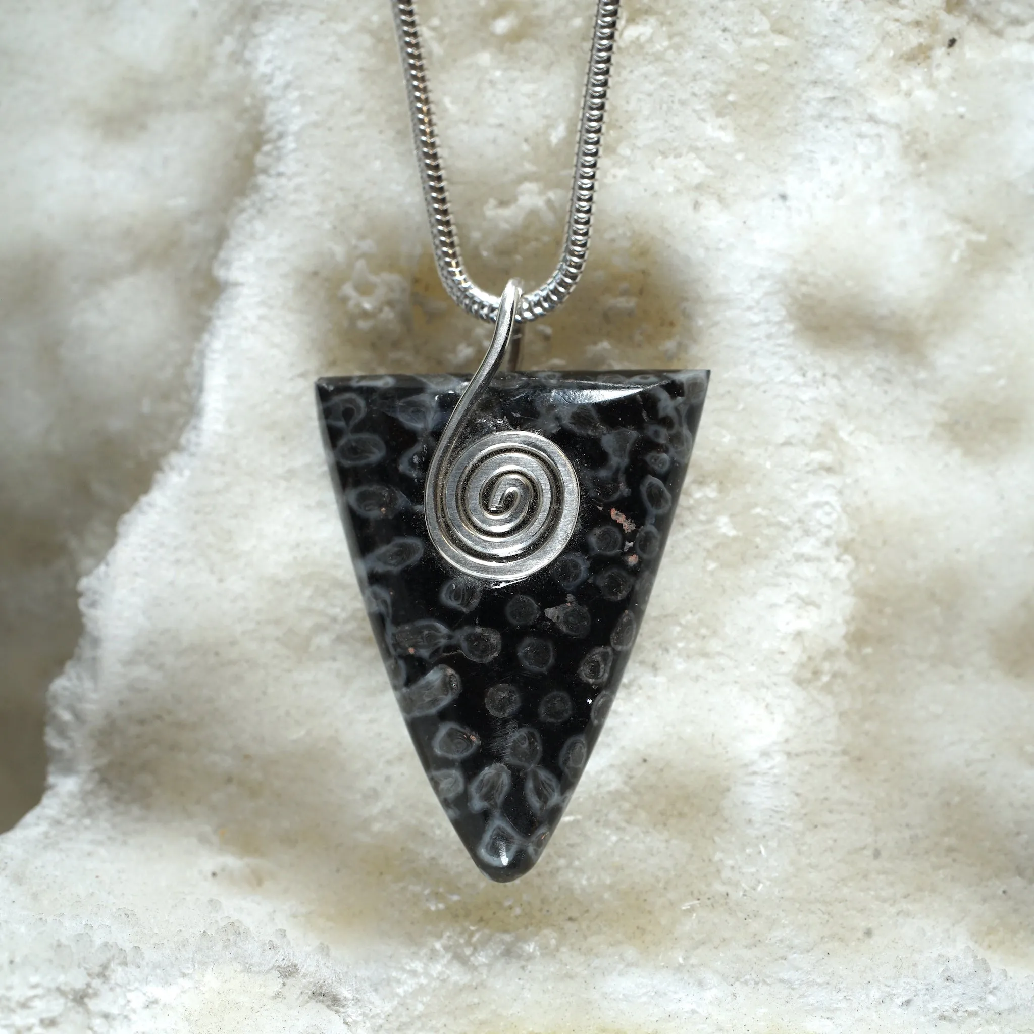 FC05P Fossilised Coral Triangle Pendant with Sterling Silver Celtic Spiral