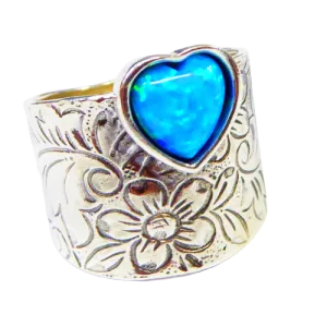 Sterling silver ring for woman set with a blue opal heart
